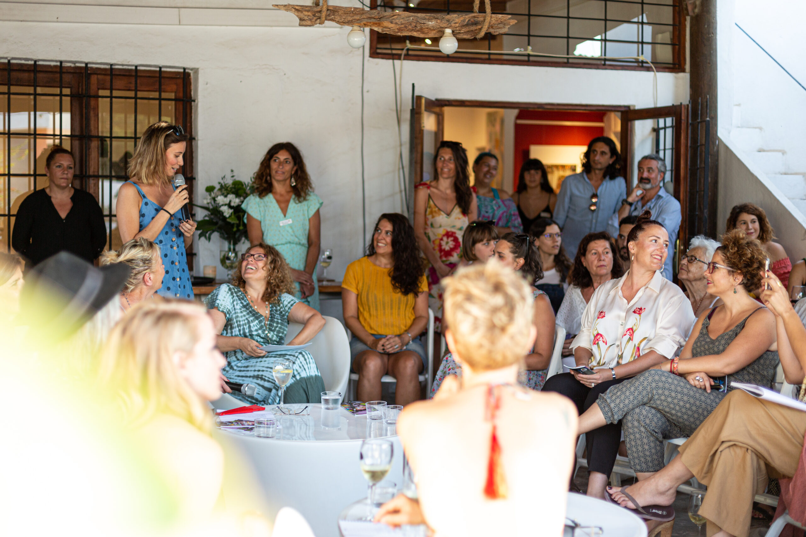 Attendees gathered at a Ladies, Wine & Design Ibiza event inside P Art Gallery.